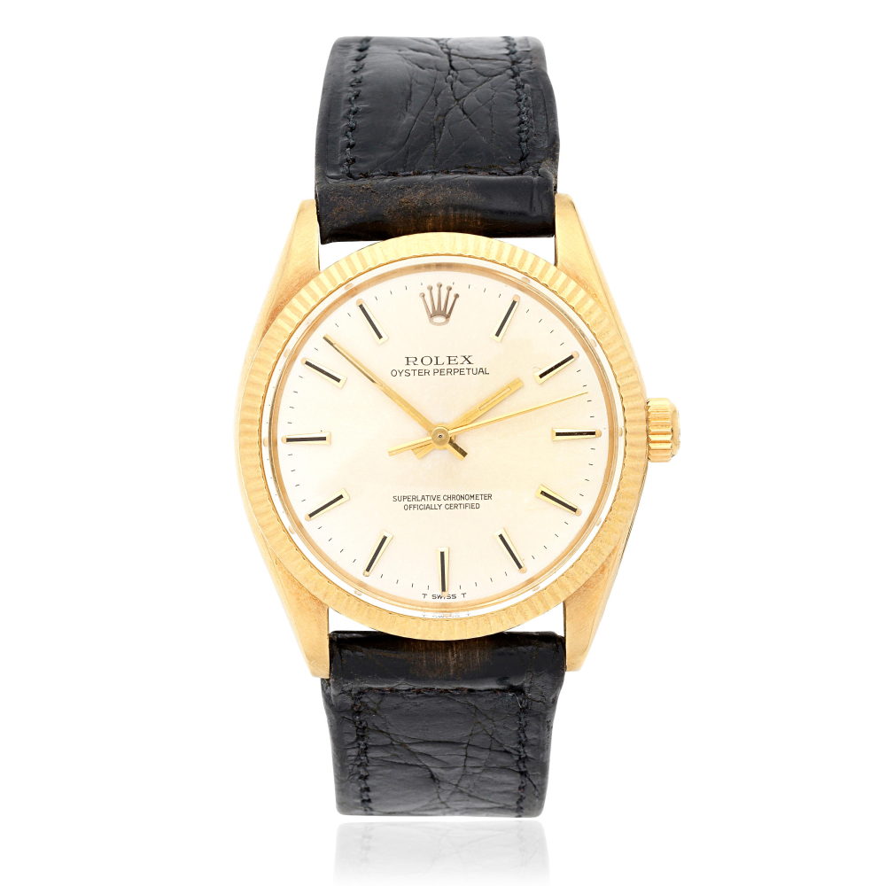Rolex. An 18K gold automatic wristwatch