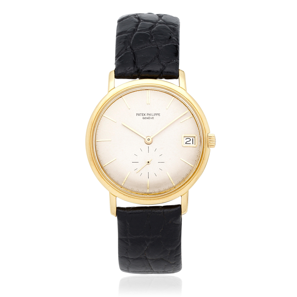 Patek Philippe. An 18K gold automatic calendar wristwatch
