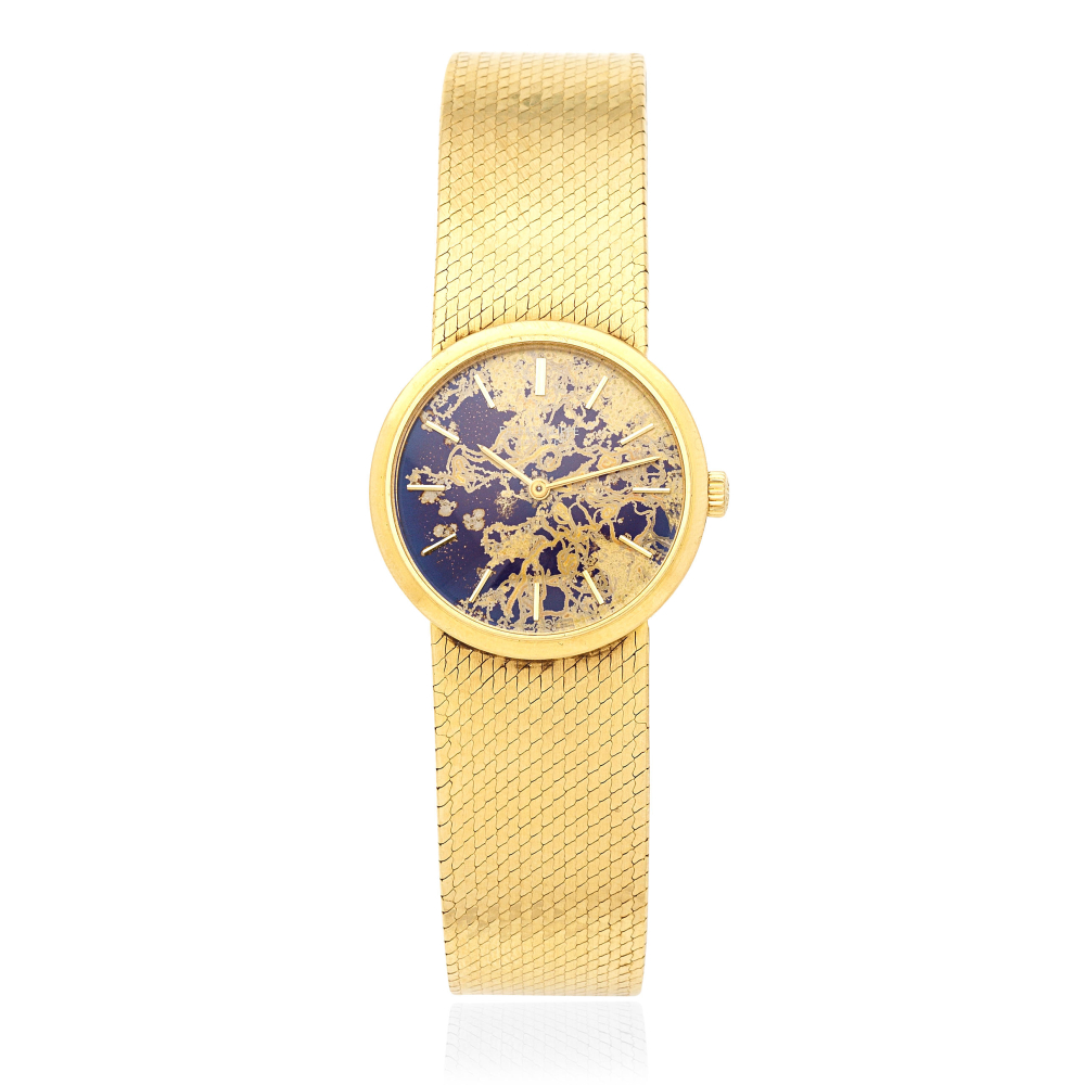 Patek Phillipe. A lady's 18K gold manual wind bracelet watch
