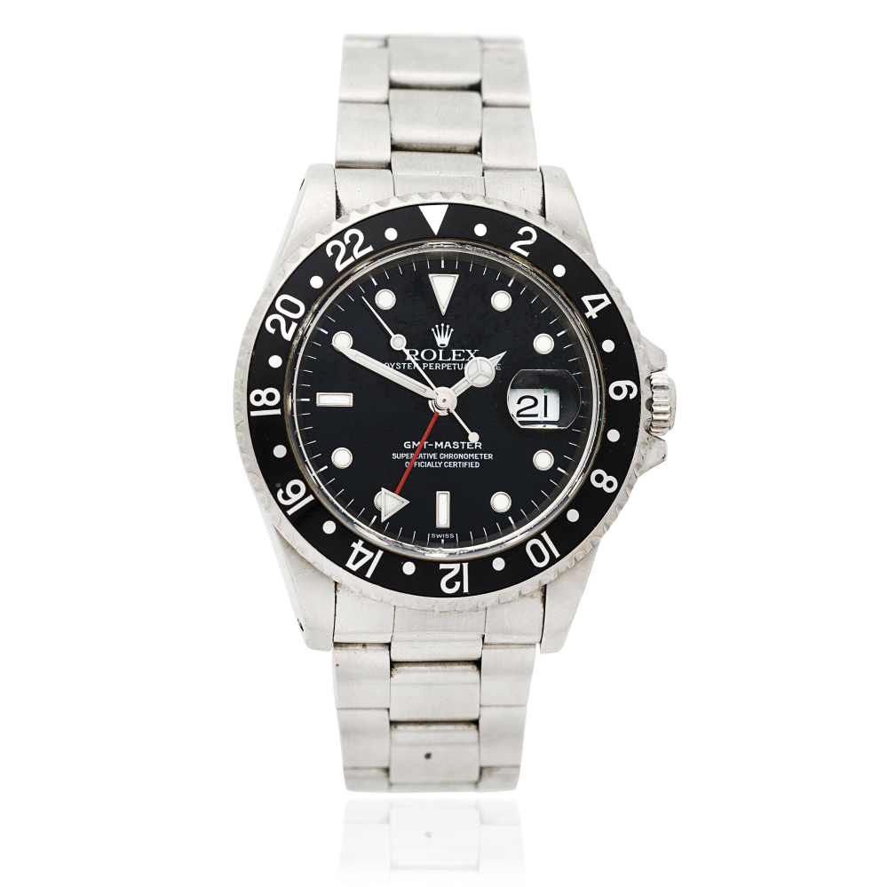 Rolex. A stainless steel automatic calendar bracelet watch with dual time zone