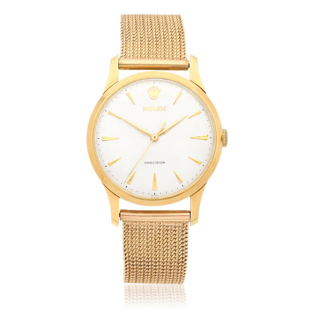 Rolex. An 18K gold manual wind bracelet watch