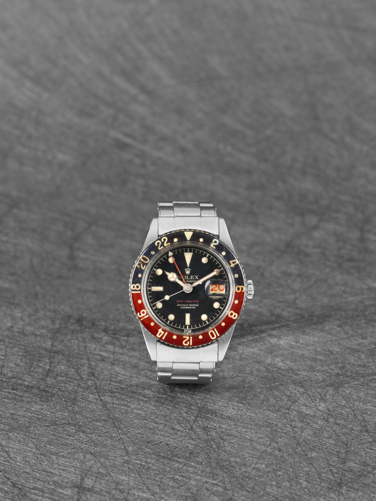 Rolex. A very fine and exceptionally rare stainless steel automatic dual time calendar wristwatch with bakelite bezel GMT-Master in red text