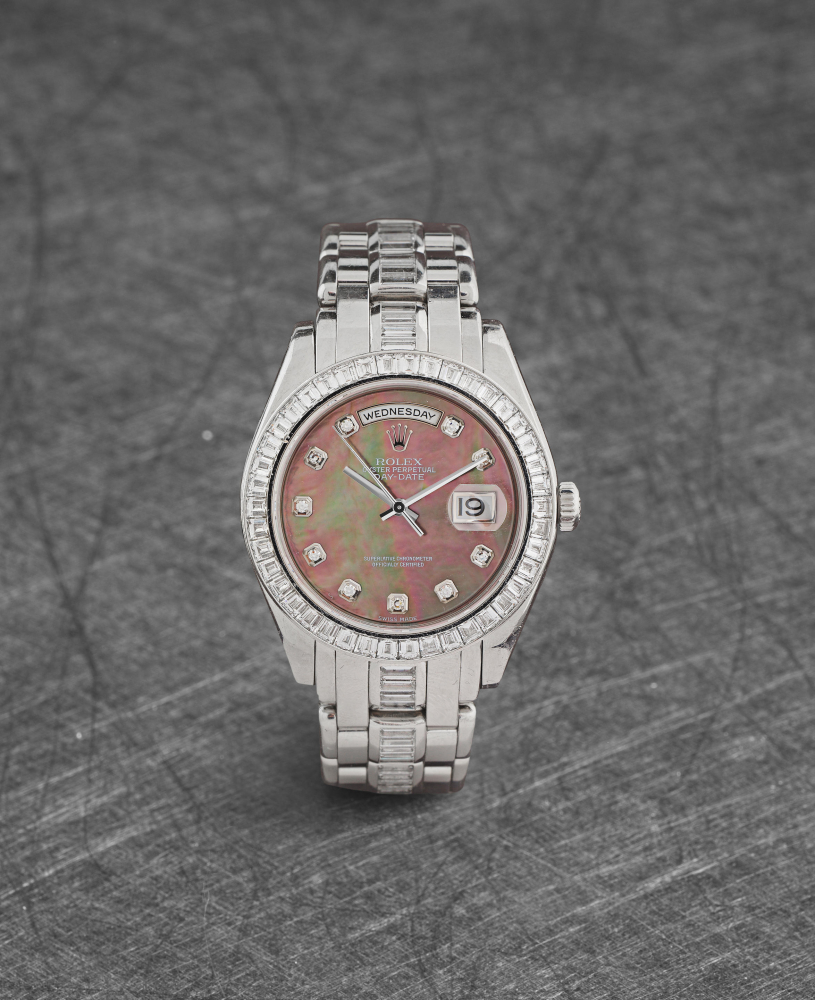 Rolex. An extremely fine and rare platinum automatic diamond set calendar bracelet watch with mother of pearl dial