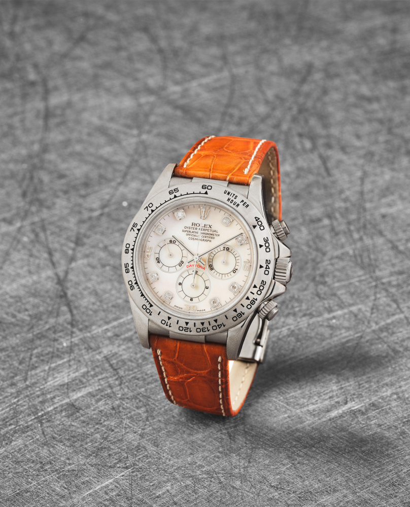 Rolex. A fine 18K white gold automatic chronograph wristwatch with diamond set mother of pearl dial