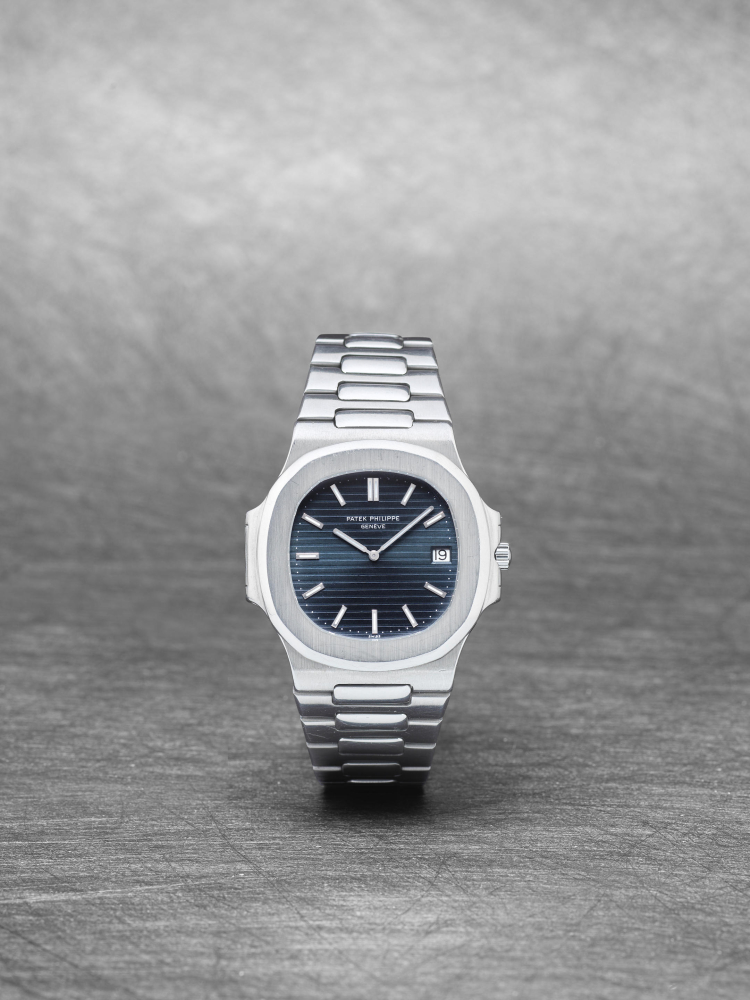 Patek Philippe. A fine and rare stainless steel automatic calendar bracelet watch