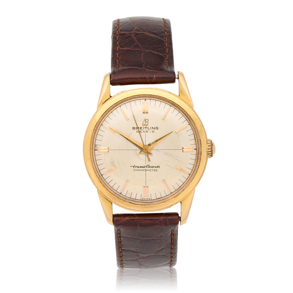 Breitling. An 18K gold automatic wristwatch
