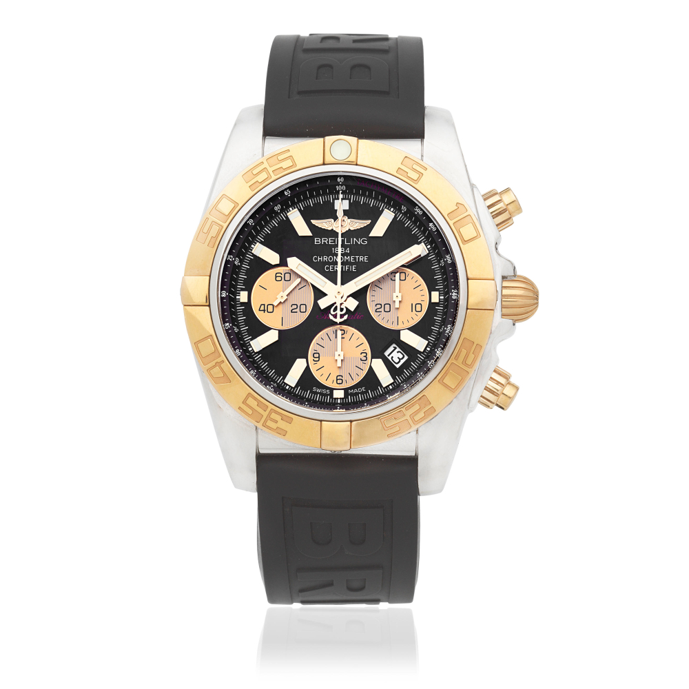Breitling. A stainless steel and gold automatic calendar chronograph wristwatch