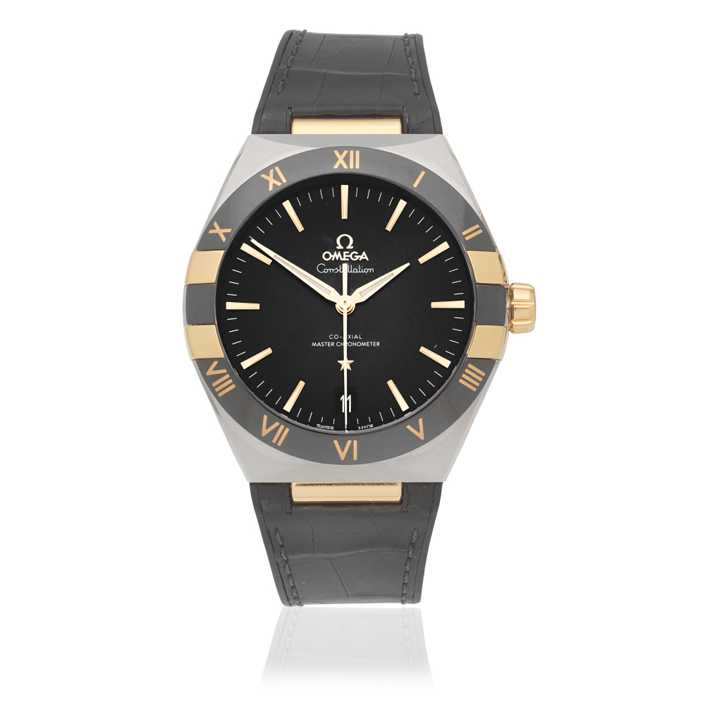 Omega. A stainless steel and 18K gold automatic calendar wristwatch with Co-Axial escapement
