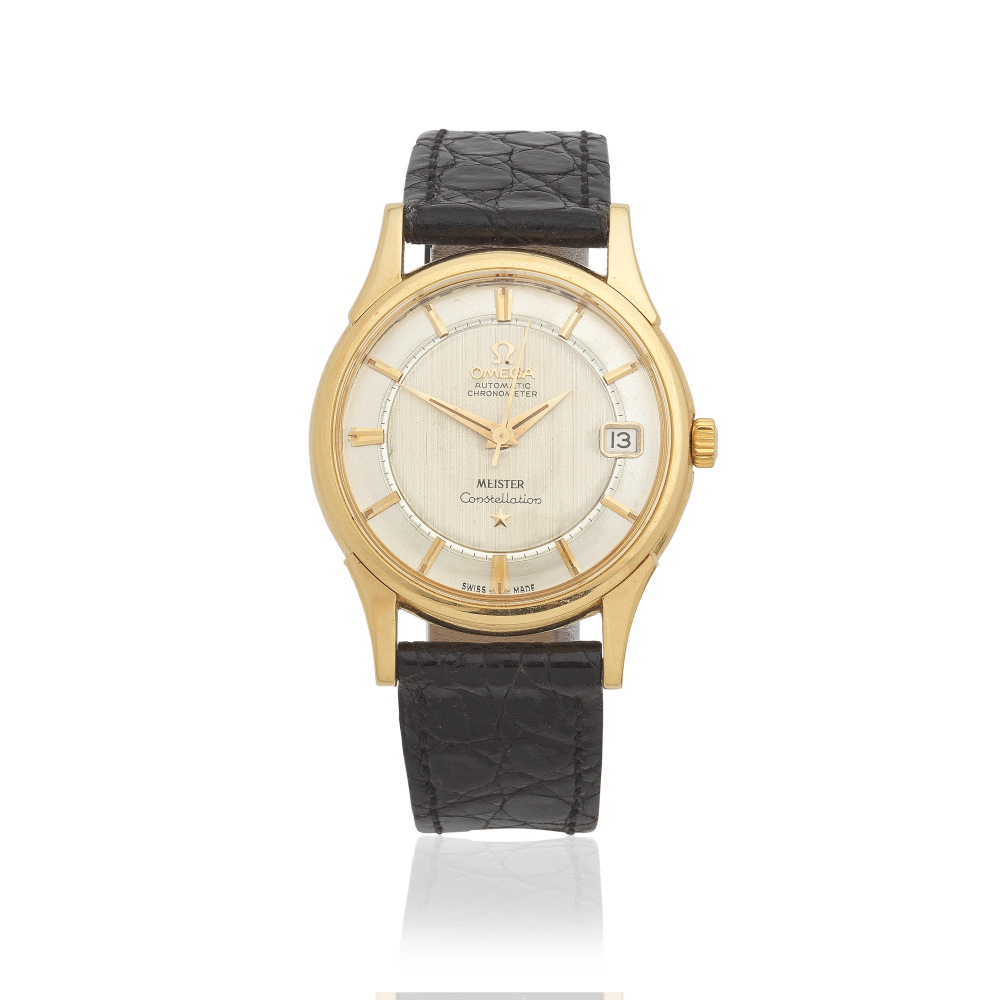 Omega. An 18K gold automatic calendar wristwatch retailed by Meister