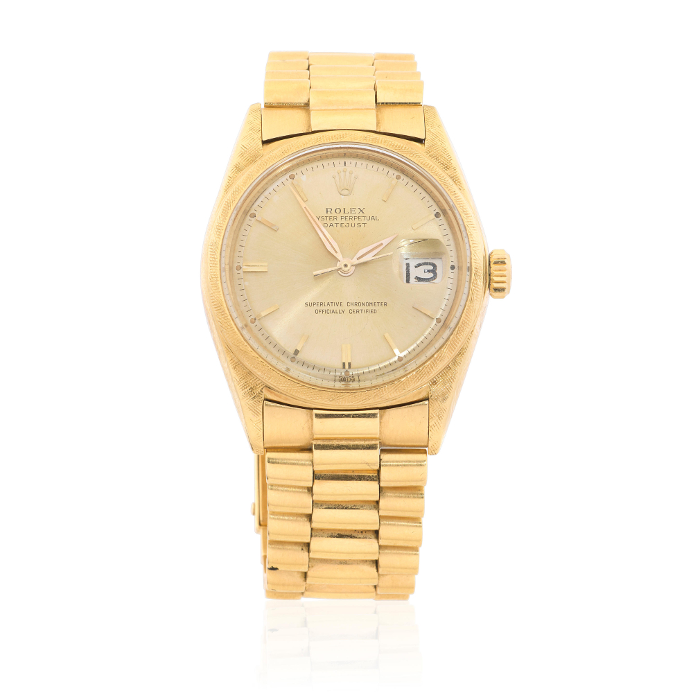Rolex. An 18K gold automatic calendar bracelet watch