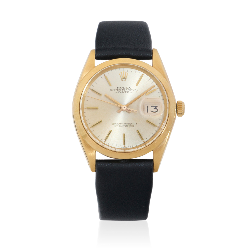Rolex. An 18K gold automatic calendar wristwatch
