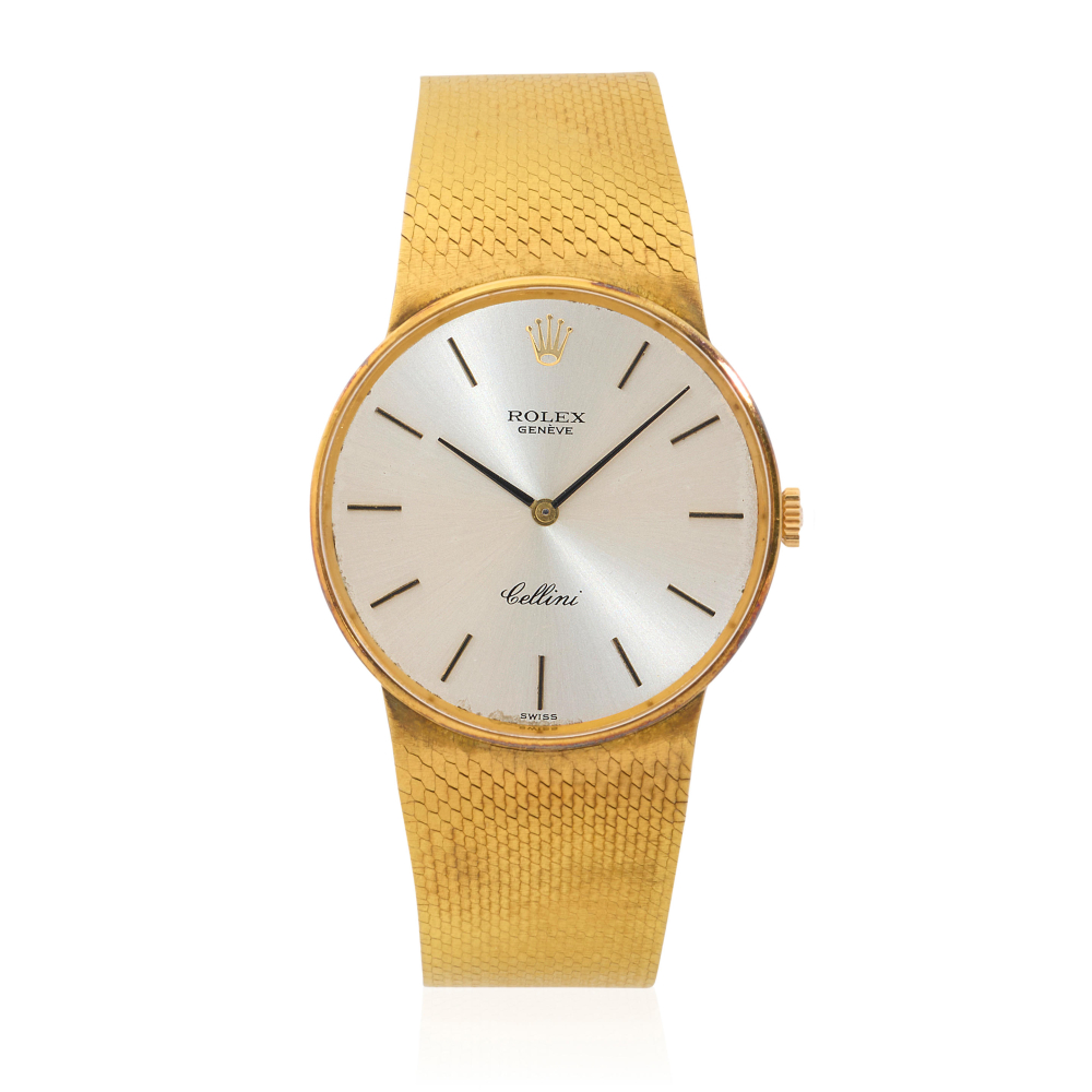 Rolex. An 18K gold manual wind watch with later 9K gold bracelet