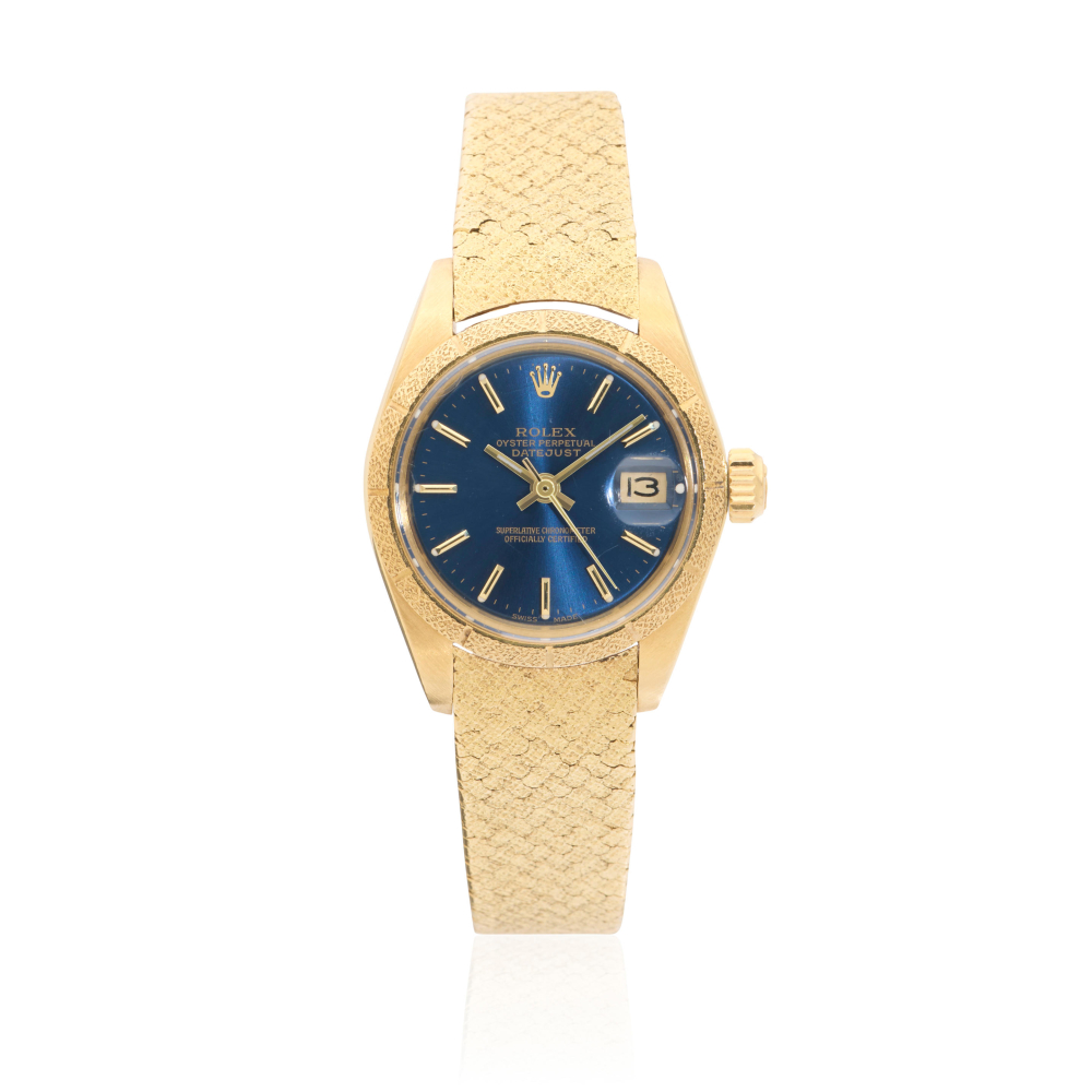Rolex. A lady's 18K gold automatic calendar bracelet watch