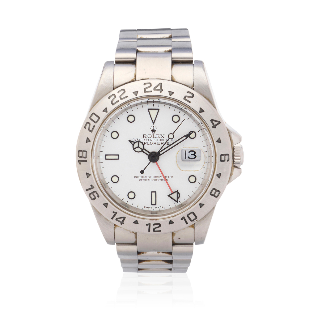 Rolex. A stainless steel automatic calendar bracelet watch with dual time zone