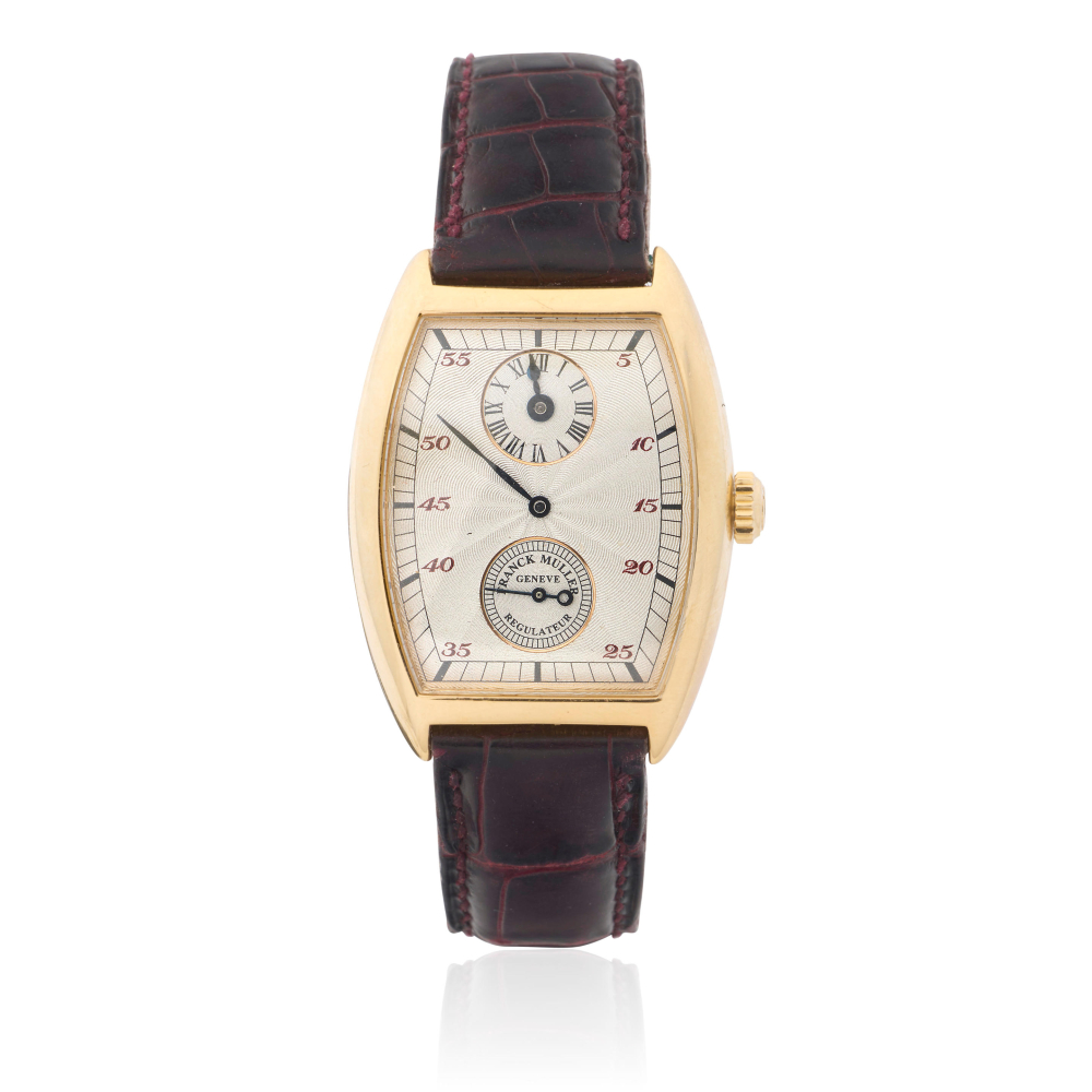 Franck Muller. An 18K gold manual wind wristwatch with regulator dial