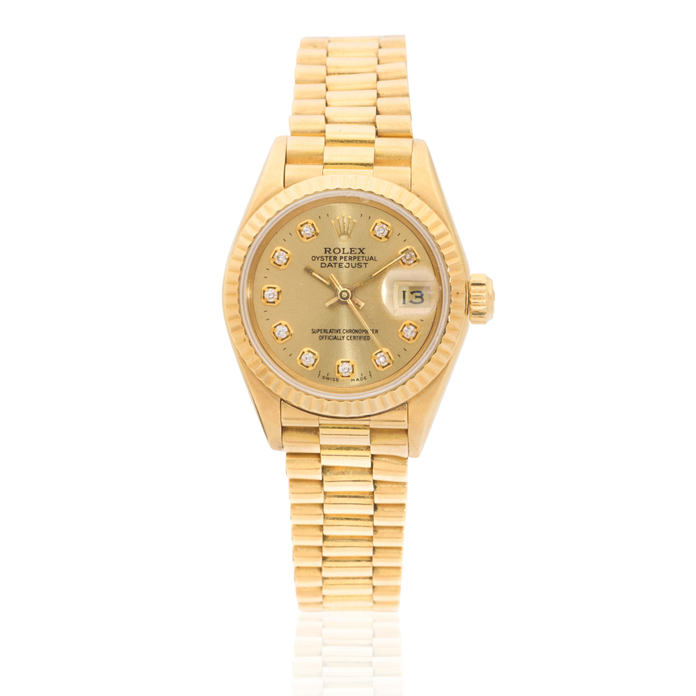 Rolex. A lady's 18K gold diamond set automatic calendar bracelet watch