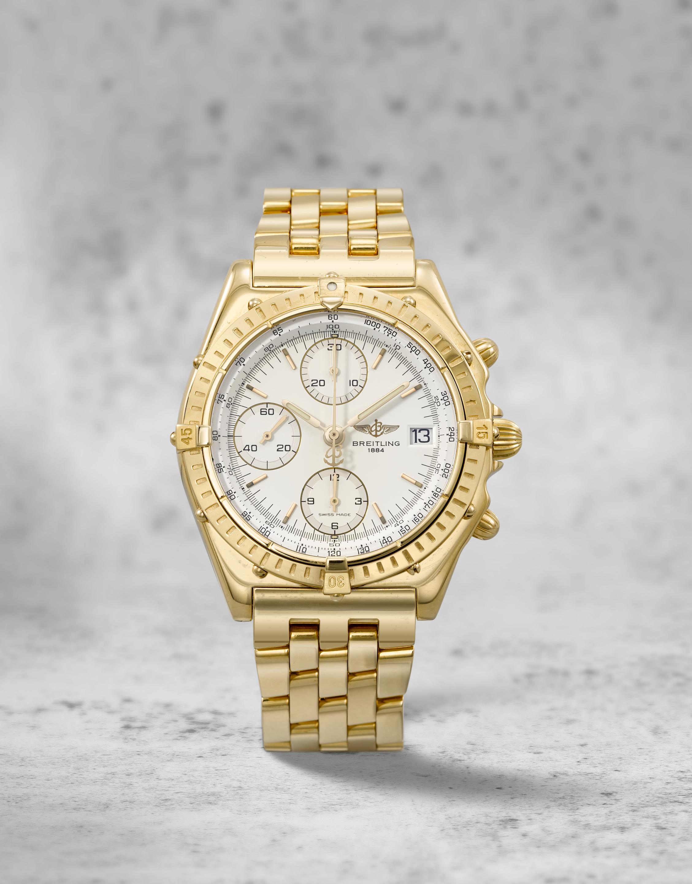 Breitling. An 18K gold automatic calendar chronograph bracelet watch