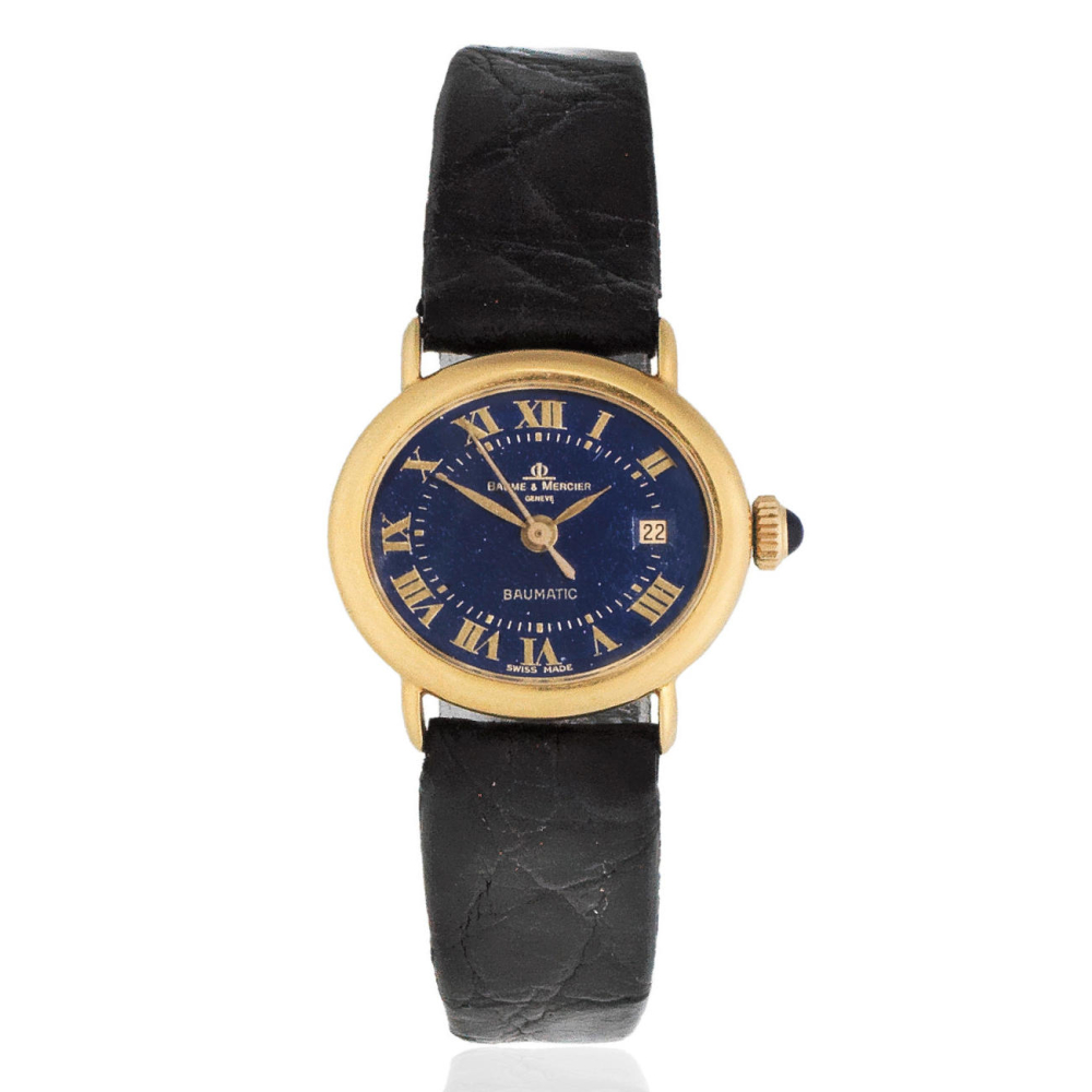 Baume Mercier. A lady's 18K gold automatic oval calendar wristwatch