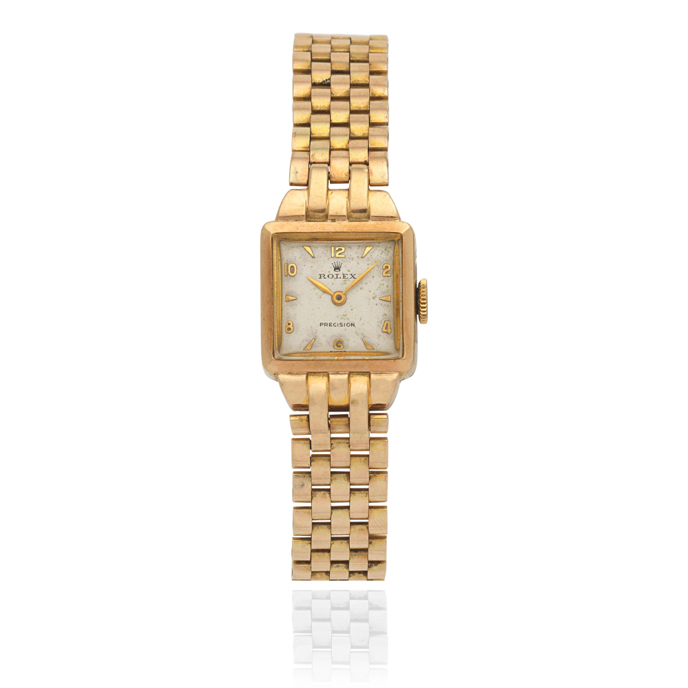 Rolex. A lady's 9K gold manual wind bracelet watch