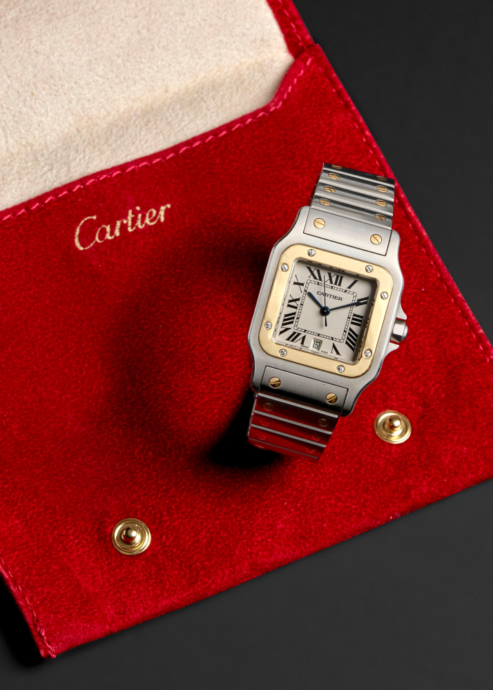CARTIER. A STAINLESS STEEL AND 18K GOLD QUARTZ BRACELET WATCH