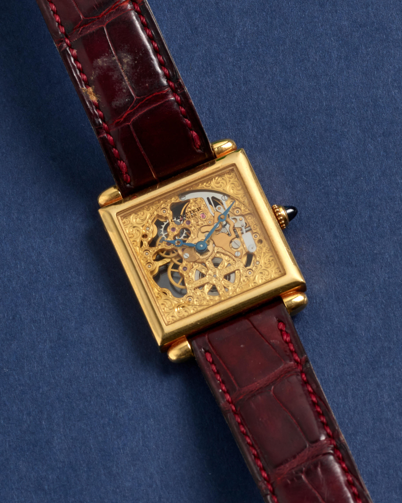 CARTIER. A FINE AND RARE LIMITED EDITION 18K GOLD MANUAL WIND SKELETONIZED WRISTWATCH