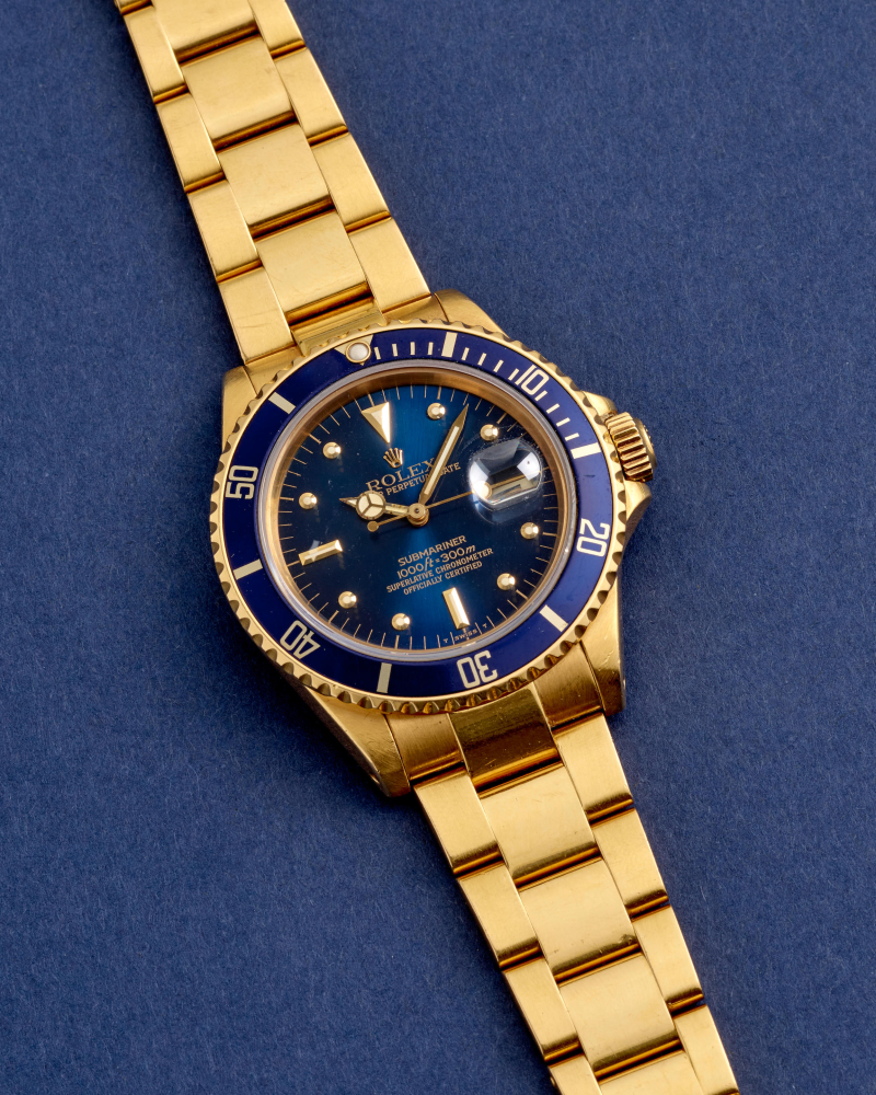 ROLEX. AN 18K GOLD AUTOMATIC CALENDAR BRACELET WATCH