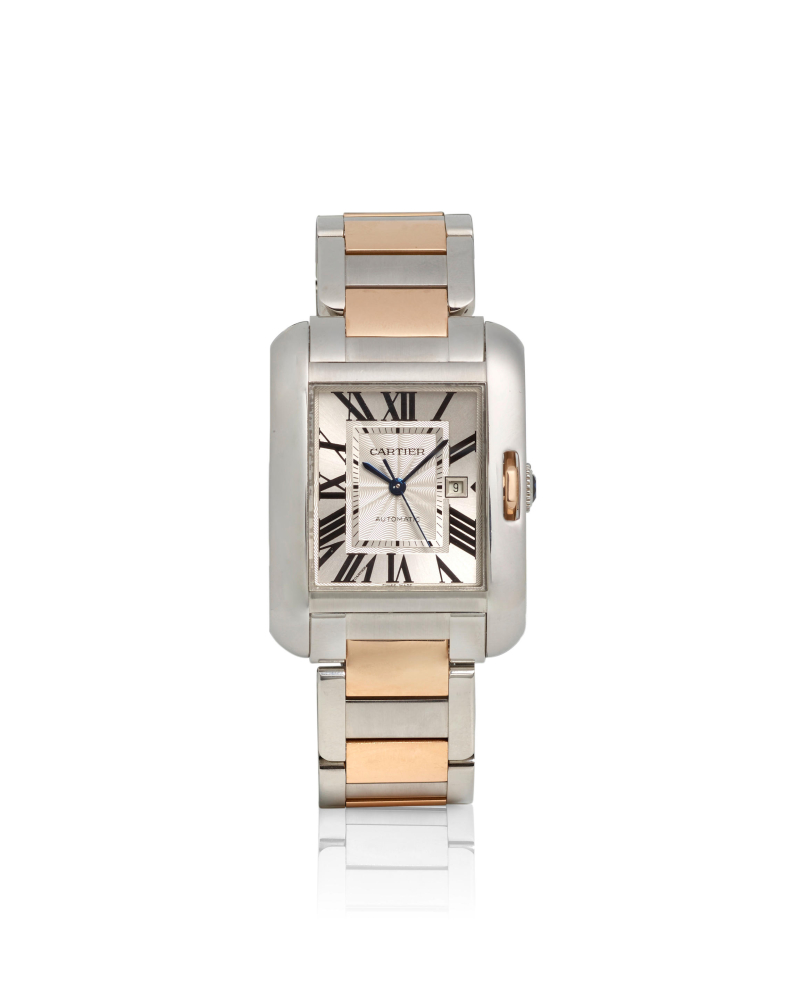 CARTIER. A STAINLESS STEEL AND 18K ROSE GOLD AUTOMATIC CALENDAR BRACELET WATCH