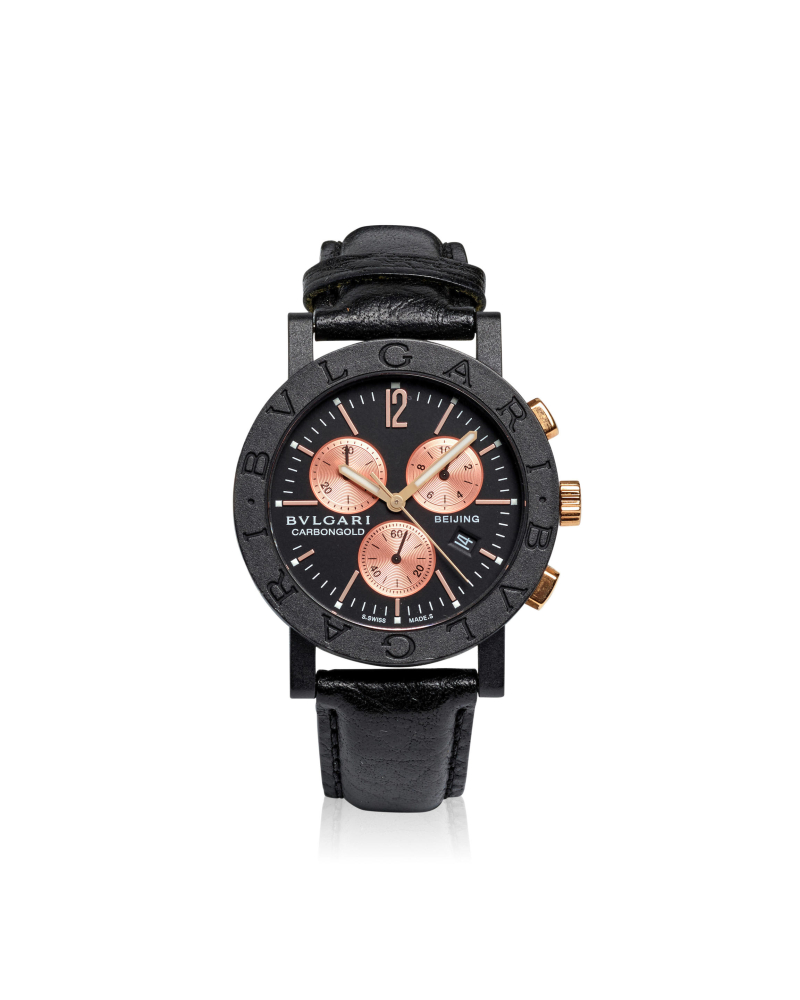 BULGARI. A CARBON GOLD QUARTZ CALENDAR CHRONOGRAPH WRISTWATCH