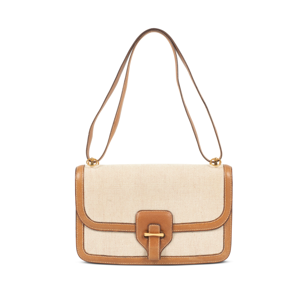 Hermès: a Toile H Canvas and Gold Courchevel Leather Sac Dolly Bag