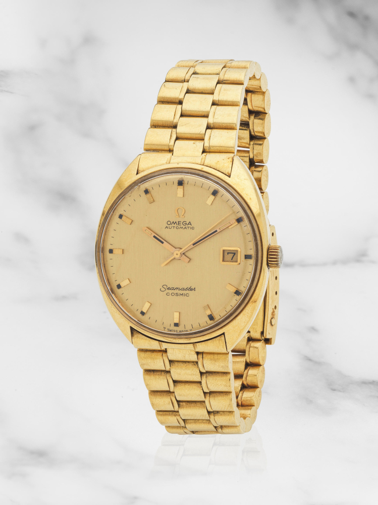 Omega. An 18K gold automatic calendar bracelet watch