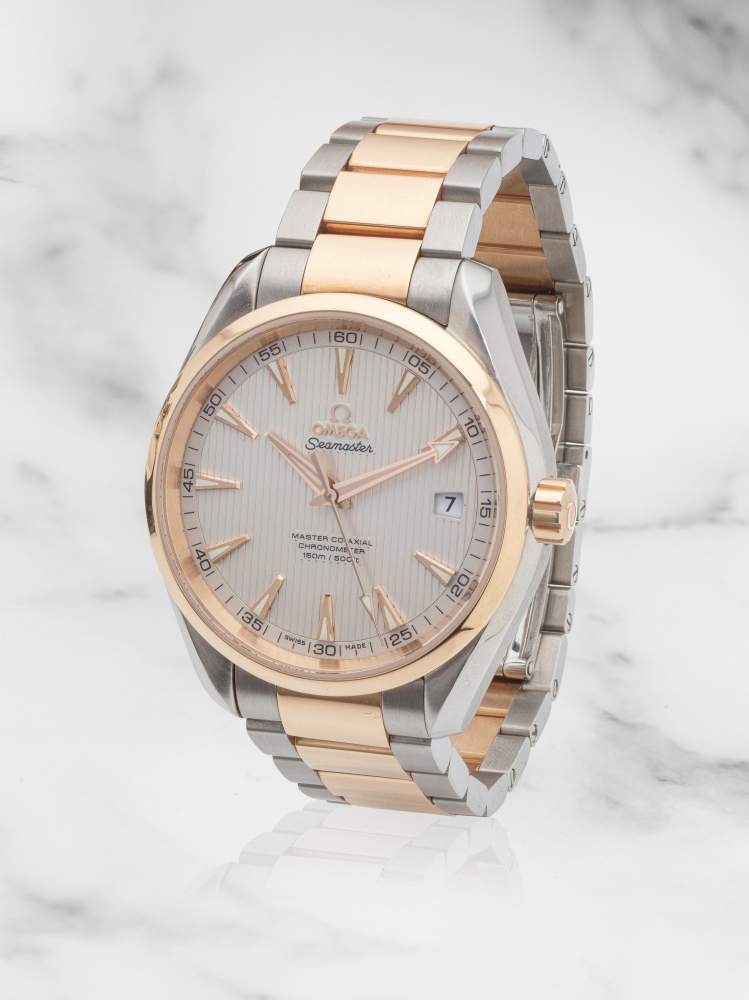 Omega. An 18K rose gold and stainless steel automatic calendar bracelet watch