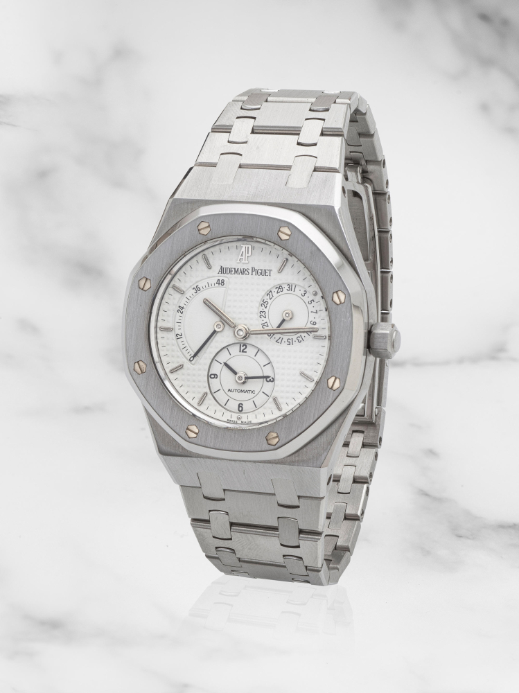 Audemars Piguet. A fine stainless steel automatic calendar bracelet watch with power reserve indication