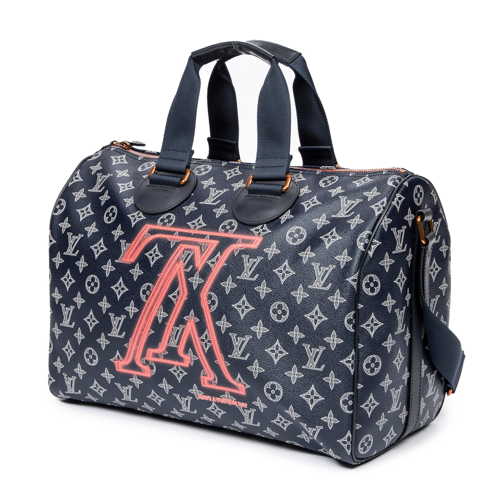 Louis VUITTON, Collection Homme Prêt à Porter Printemps/Hiver 2018. Sac "Speedy" en toile Shadow bleue et Upside Down Monogram.