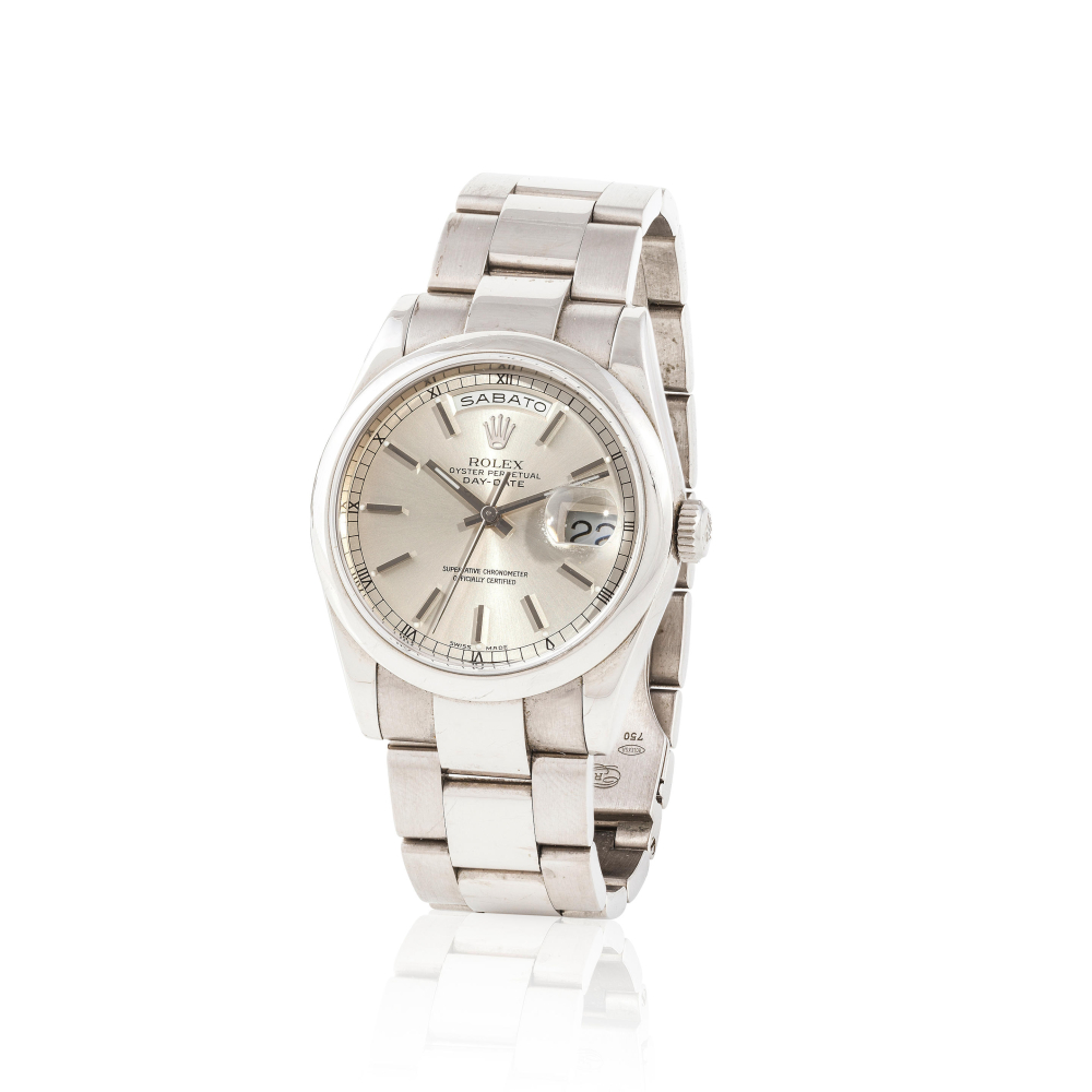 Rolex. A fine 18K white gold automatic with day and date indication bracelet watch