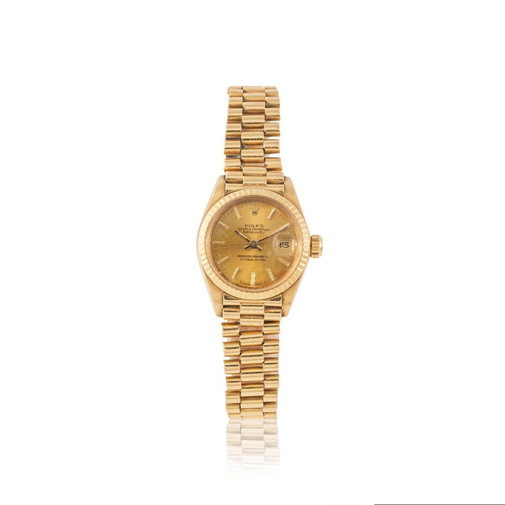Rolex. A lady's 18K gold automatic calendar bracelet watch