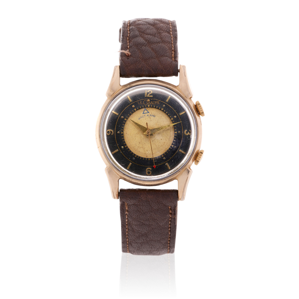 LeCoultre. A 10K gold filled manual wind wristwatch with alarm