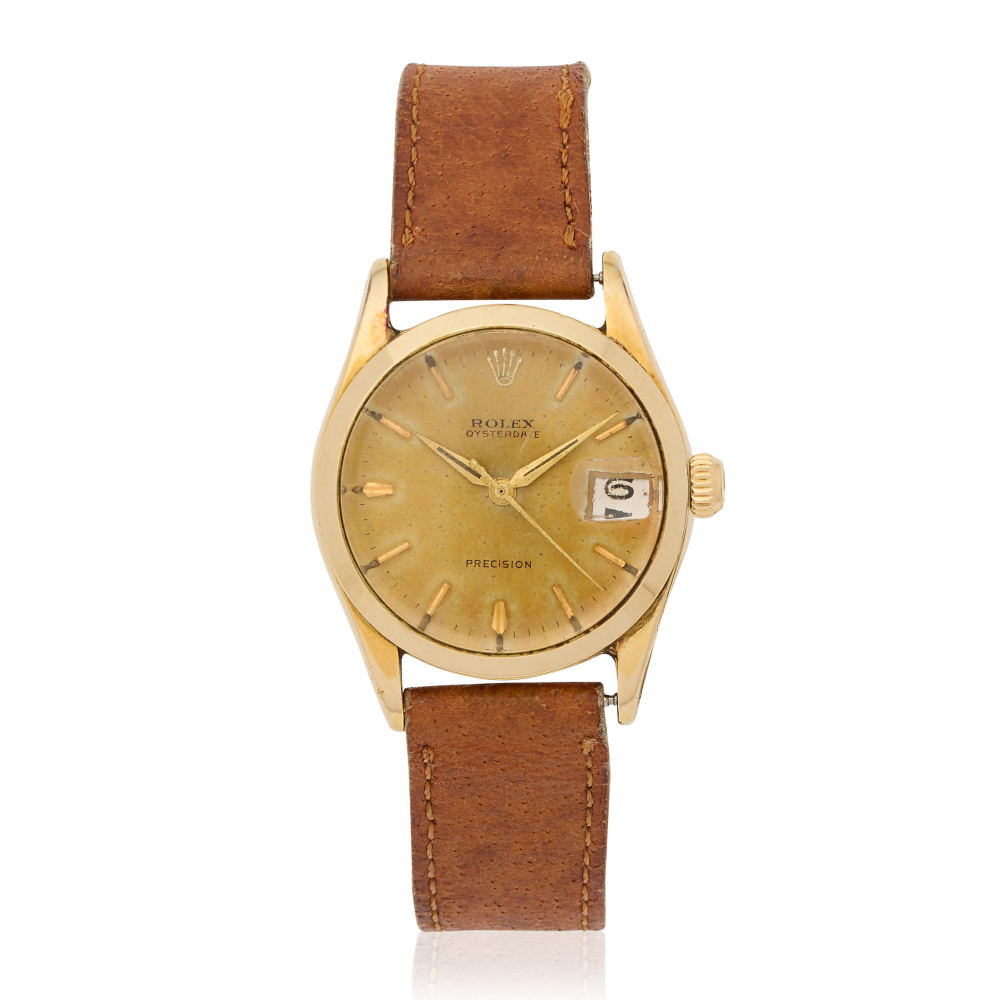 Rolex. A gold plated manual wind calendar wristwatch