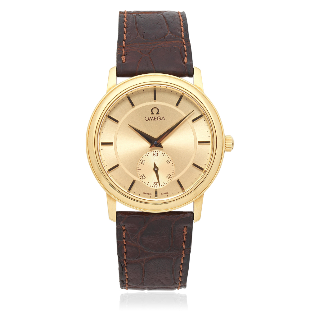 Omega. An 18K gold manual wind wristwatch