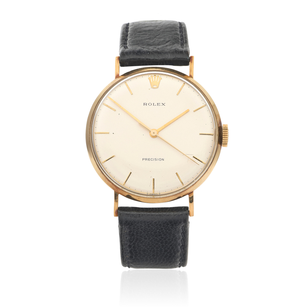 Rolex. A 9K gold manual wind wristwatch