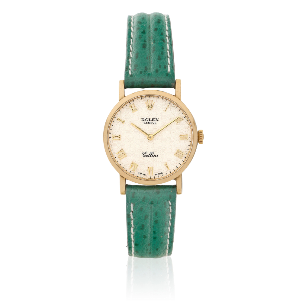 Rolex. A lady's 18K gold manual wind wristwatch