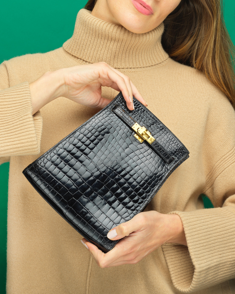 Hermes: a Shiny Black Porosus Crocodile Kelly Sport PM