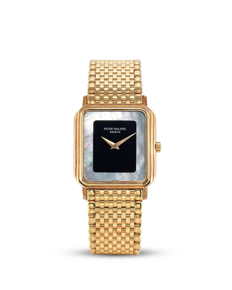 PATEK PHILIPPE | REF.3859, A YELLOW GOLD WRISTWATCH WITH MOTHER-OF-PEARL AND ONYX DIAL AND NON-MAKER'S YELLOW GOLD BRACELET, CIRCA 1980