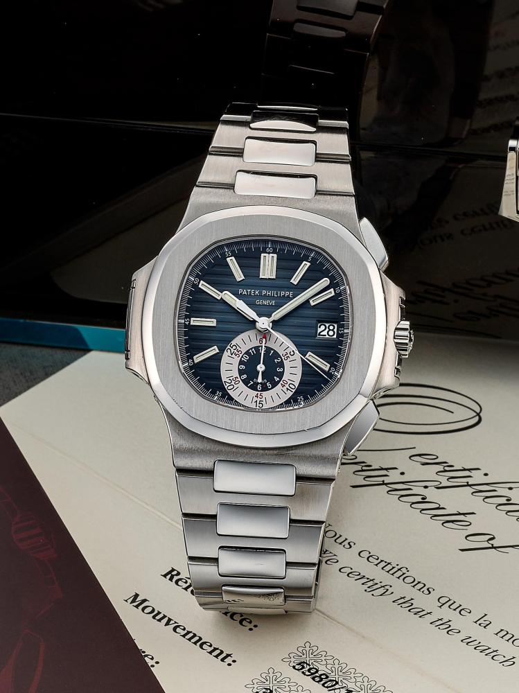 PATEK PHILIPPE | NAUTILUS - GENEVA SEAL, REF.5980/1A-001, A STAINLESS STEEL FLYBACK CHRONOGRAPH BRACELET WATCH WITH DATE, CIRCA 2007