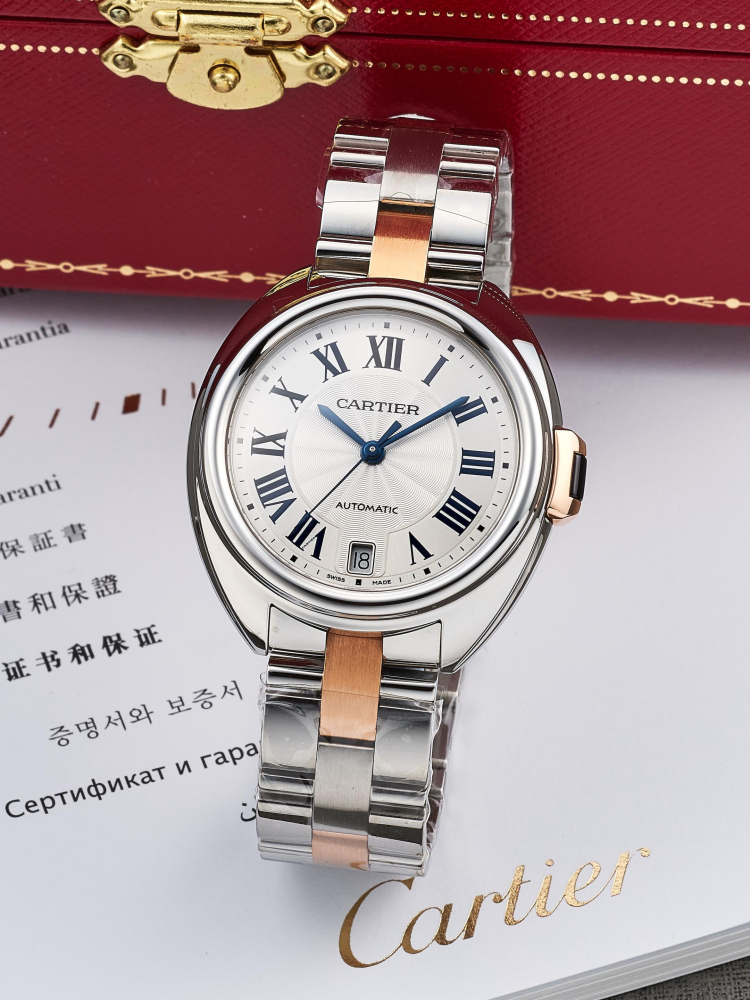CARTIER | CLÉ DE CARTIER, REF.3856, A NEW OLD STOCK STAINLESS STEEL AND PINK GOLD BRACELET WATCH WITH DATE, CIRCA 2018
