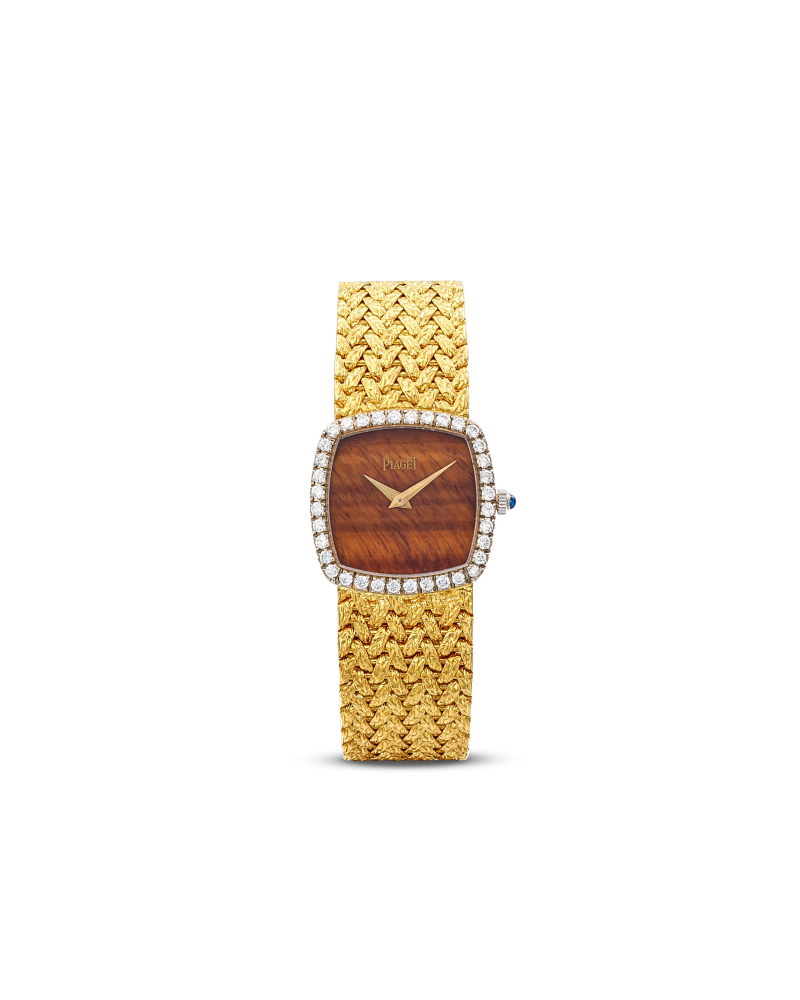 PIAGET | REF.9236 A YELLOW GOLD AND DIAMOND-SET BRACELET WATCH WITH TIGER'S EYE DIAL, CIRCA 1980