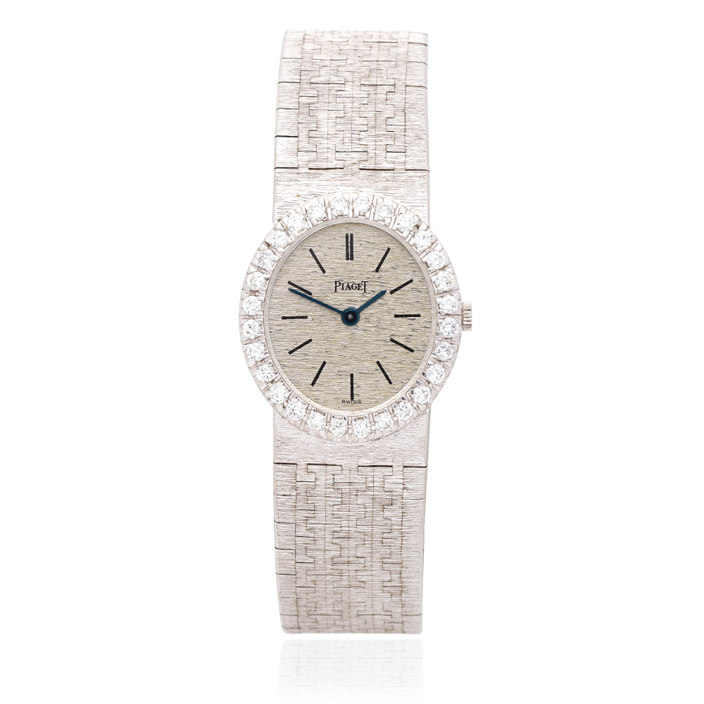 Piaget. A lady's 18K white gold and diamond set manual wind bracelet watch