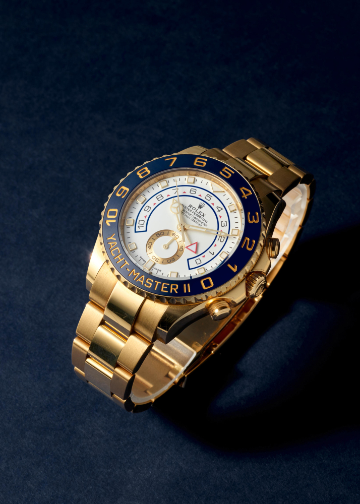 ROLEX. AN 18K GOLD AUTOMATIC FLYBACK REGATTA CHRONOGRAPH BRACELET WATCH