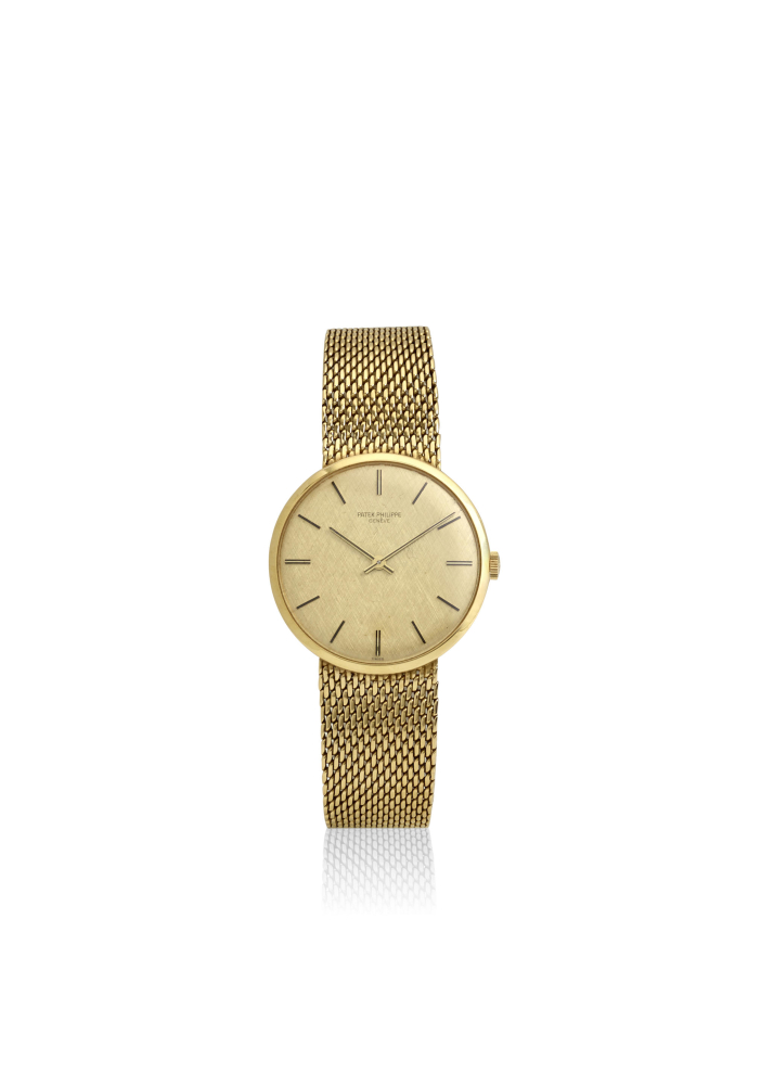PATEK PHILIPPE. AN 18K GOLD MANUAL WIND BRACELET WATCH