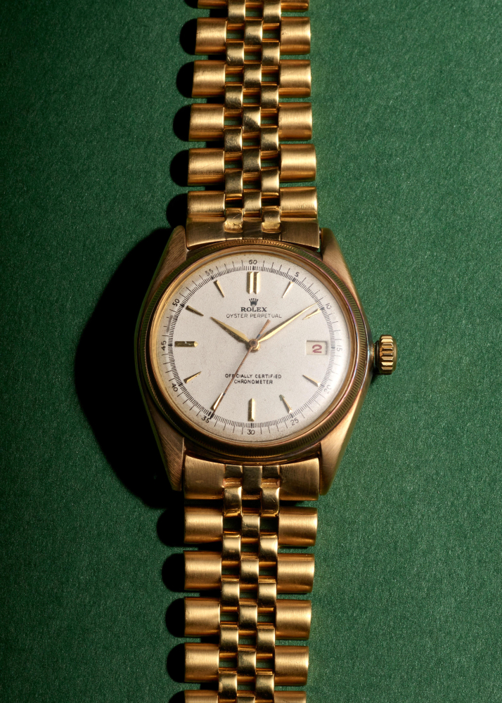 ROLEX. A RARE 18K GOLD AUTOMATIC CALENDAR BRACELET WATCH
