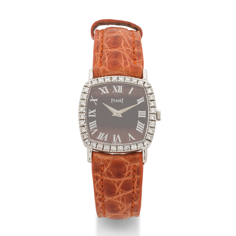 Piaget. A fine lady's 18K white gold and diamond set bezel manual wind wristwatch